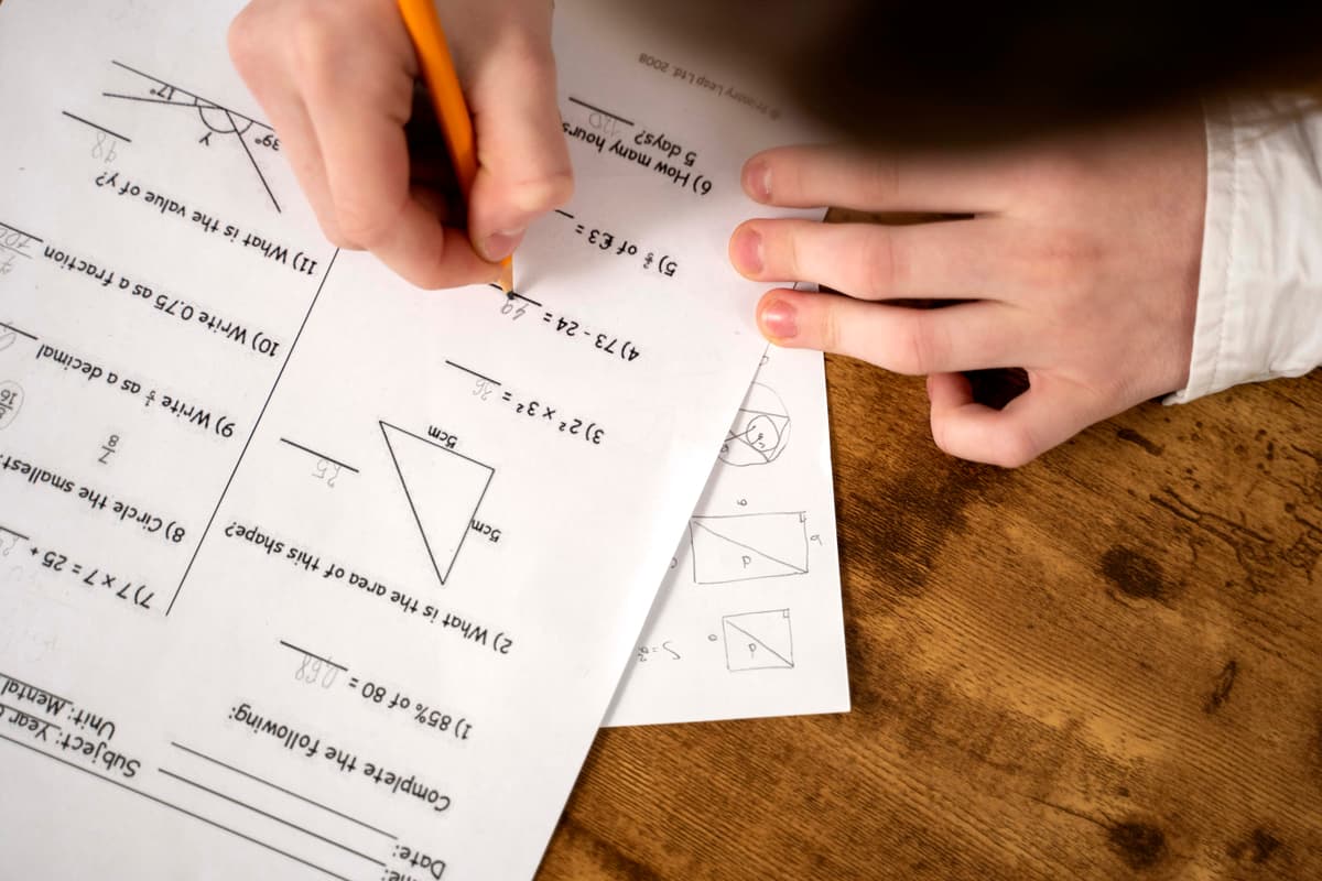 top-view-kid-cheating-school