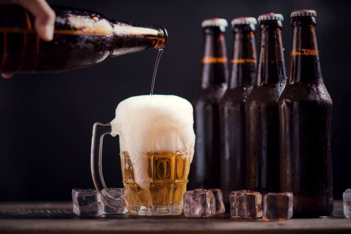 glass-bottles-beer-with-glass-ice-dark-background